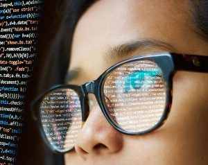 edited woman programming glasses reflect